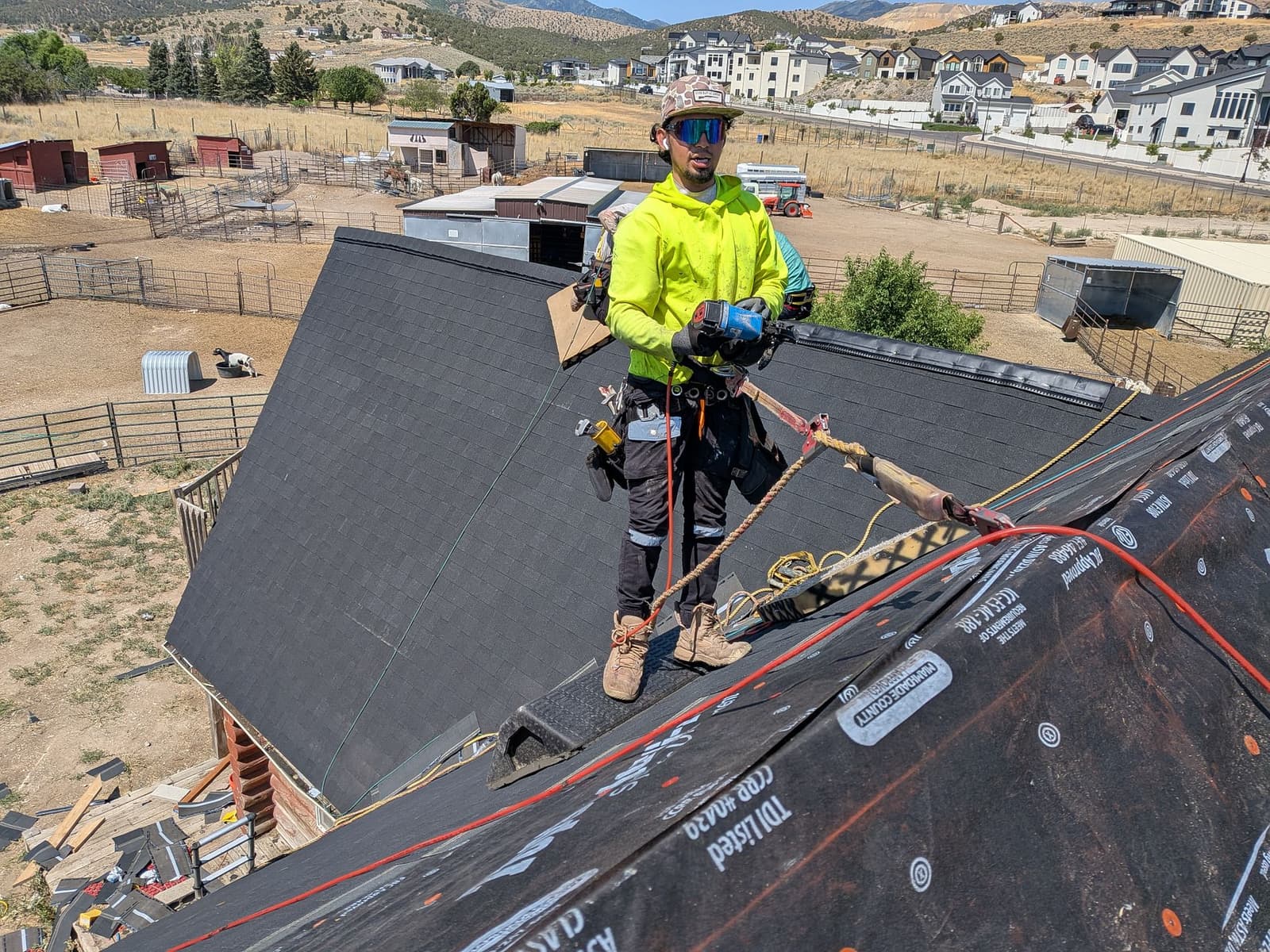 Worker repairing residential gutter system