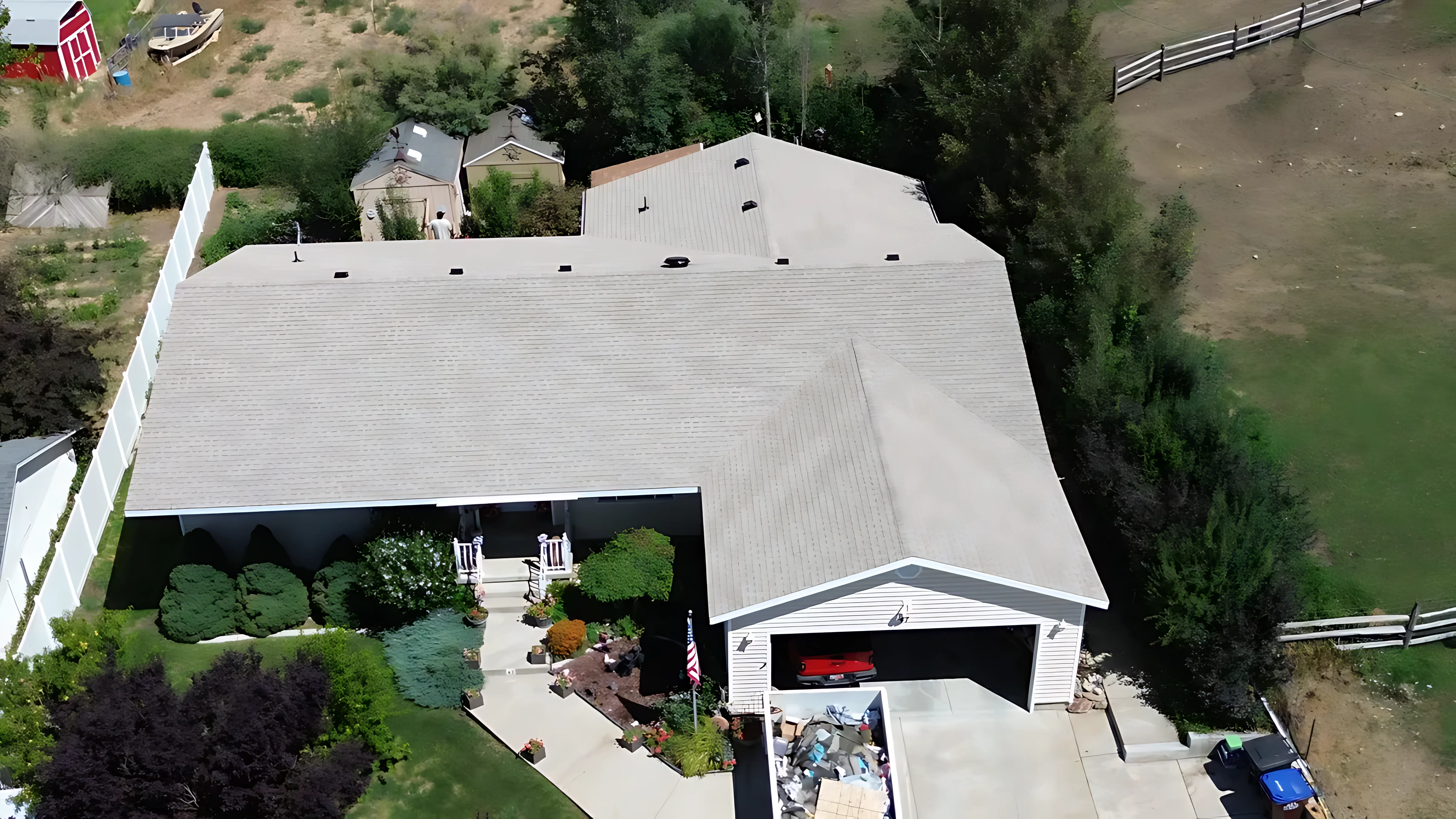 Roofing crew starting a tear-off at sunrise for a fast 1-day replacement