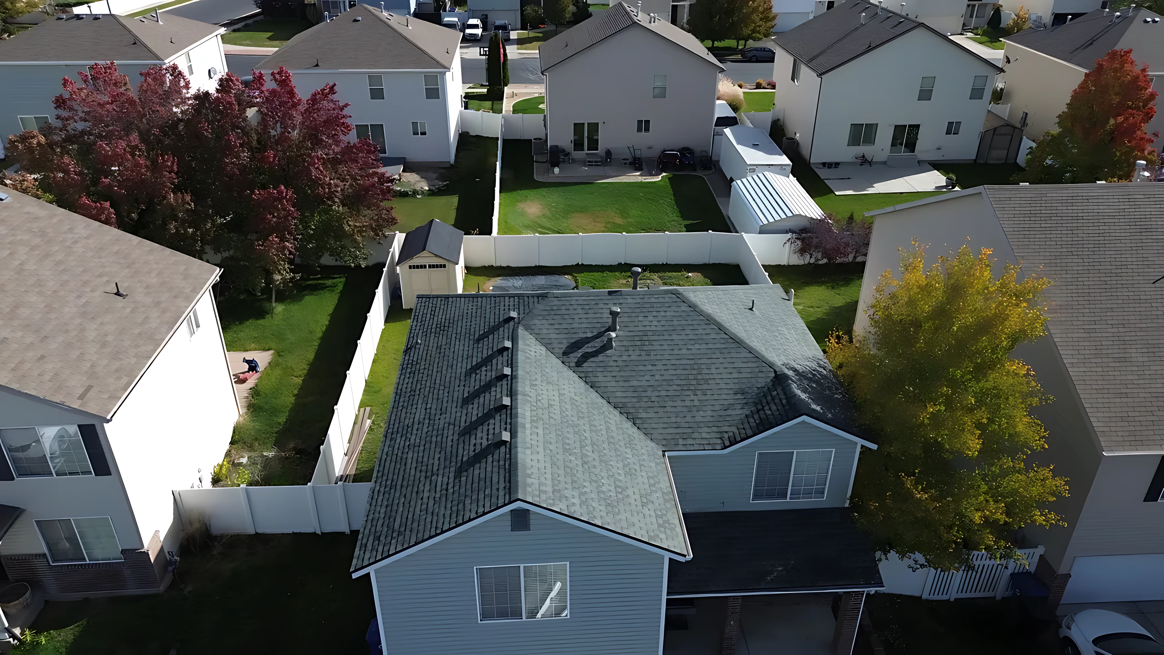 Sky Ridge technician inspecting a roof cricket for signs of wear and proper drainage