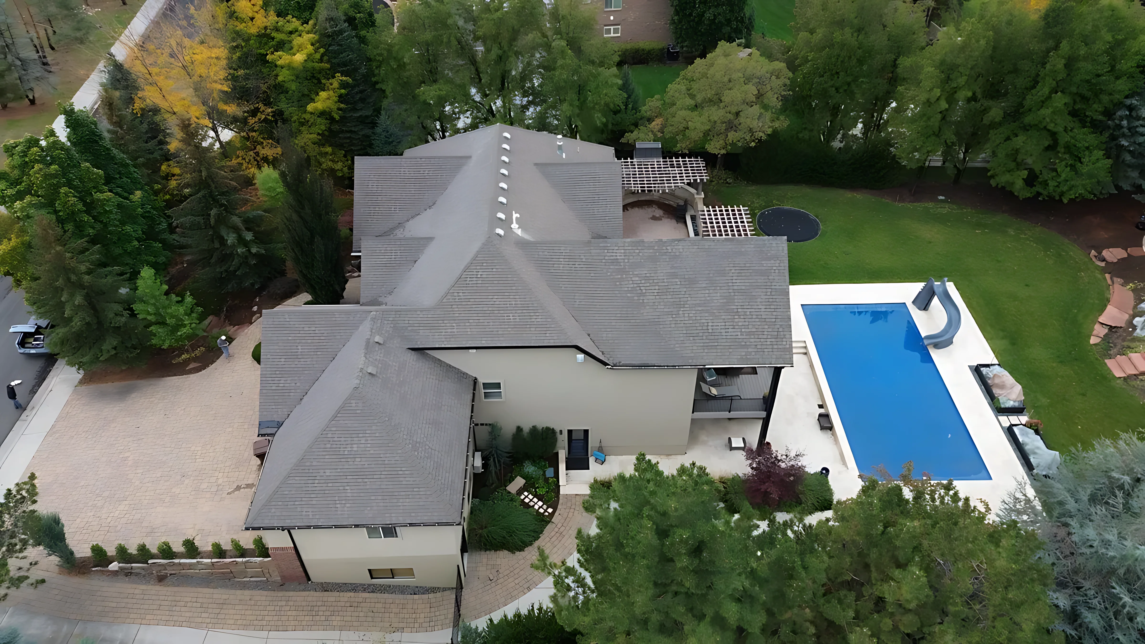 Drifted snow on a complex roofline showing concentrated load areas