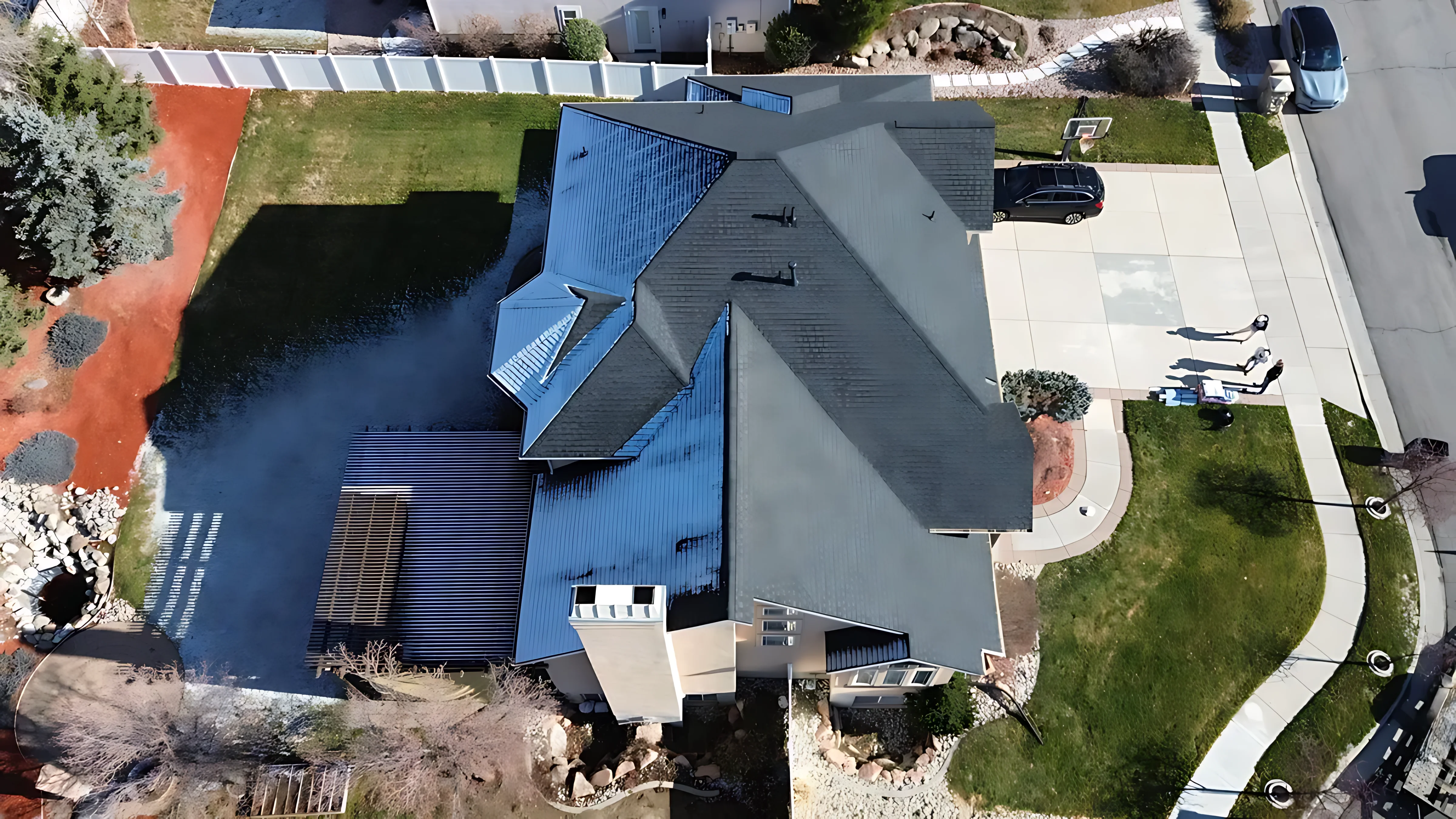 Professional roofer inspecting roof deck integrity before a material upgrade