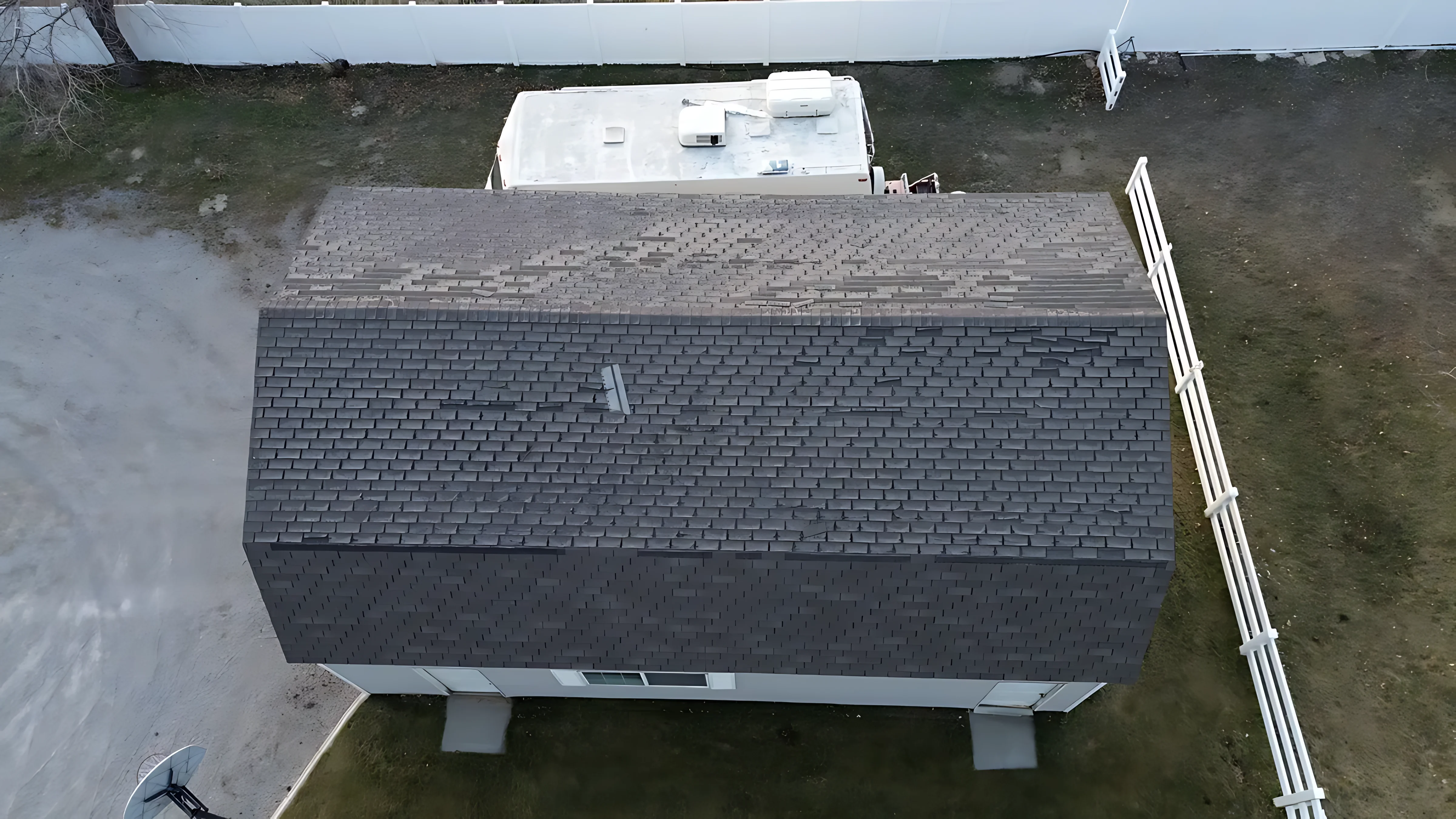 Sky Ridge representative explaining gutter integration with new roofing shingles