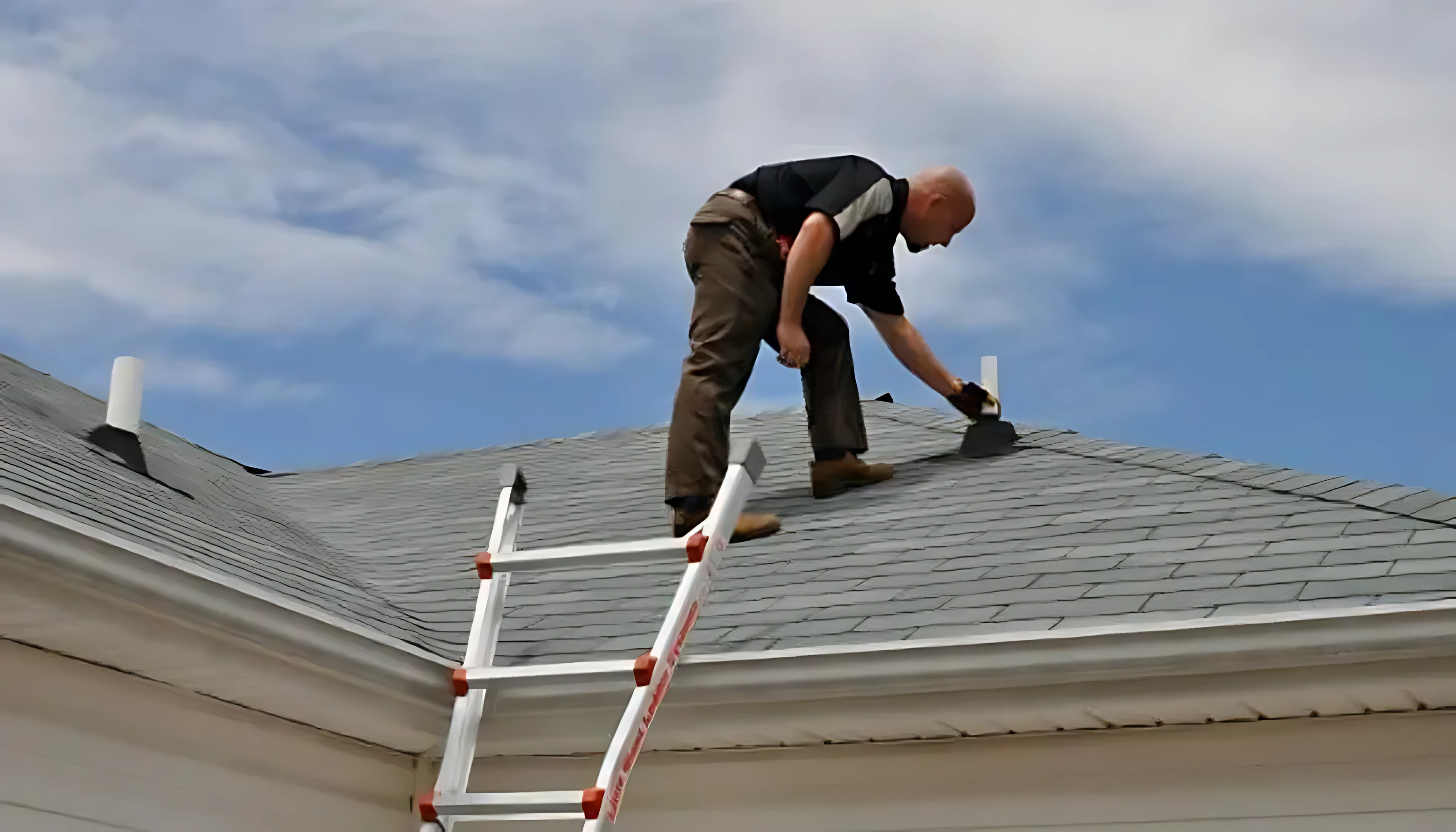 Sky Ridge inspector tracing a leak path in a Utah attic with a high-lumen light and moisture probe
