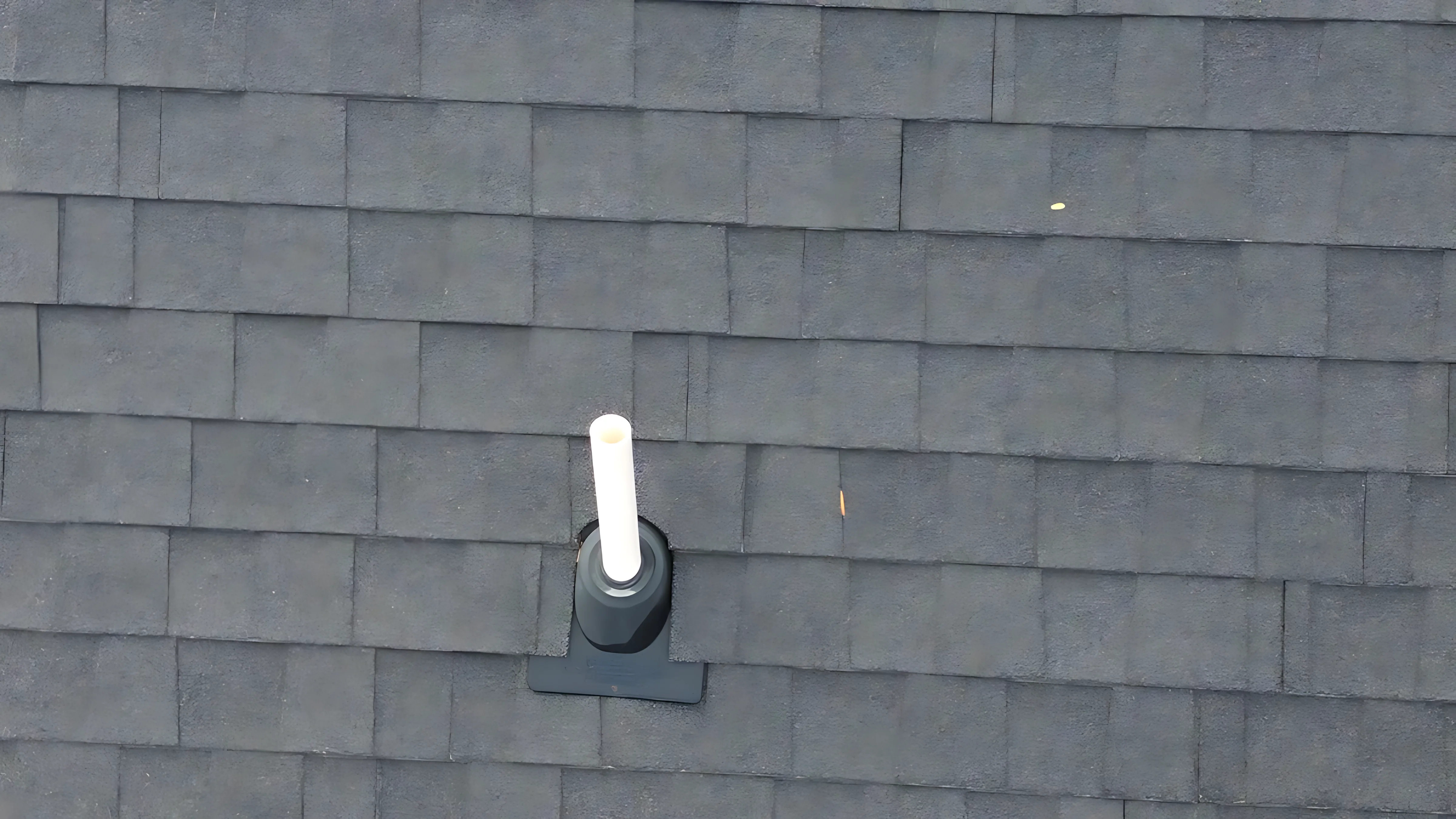 Roofing crew site overview from drone